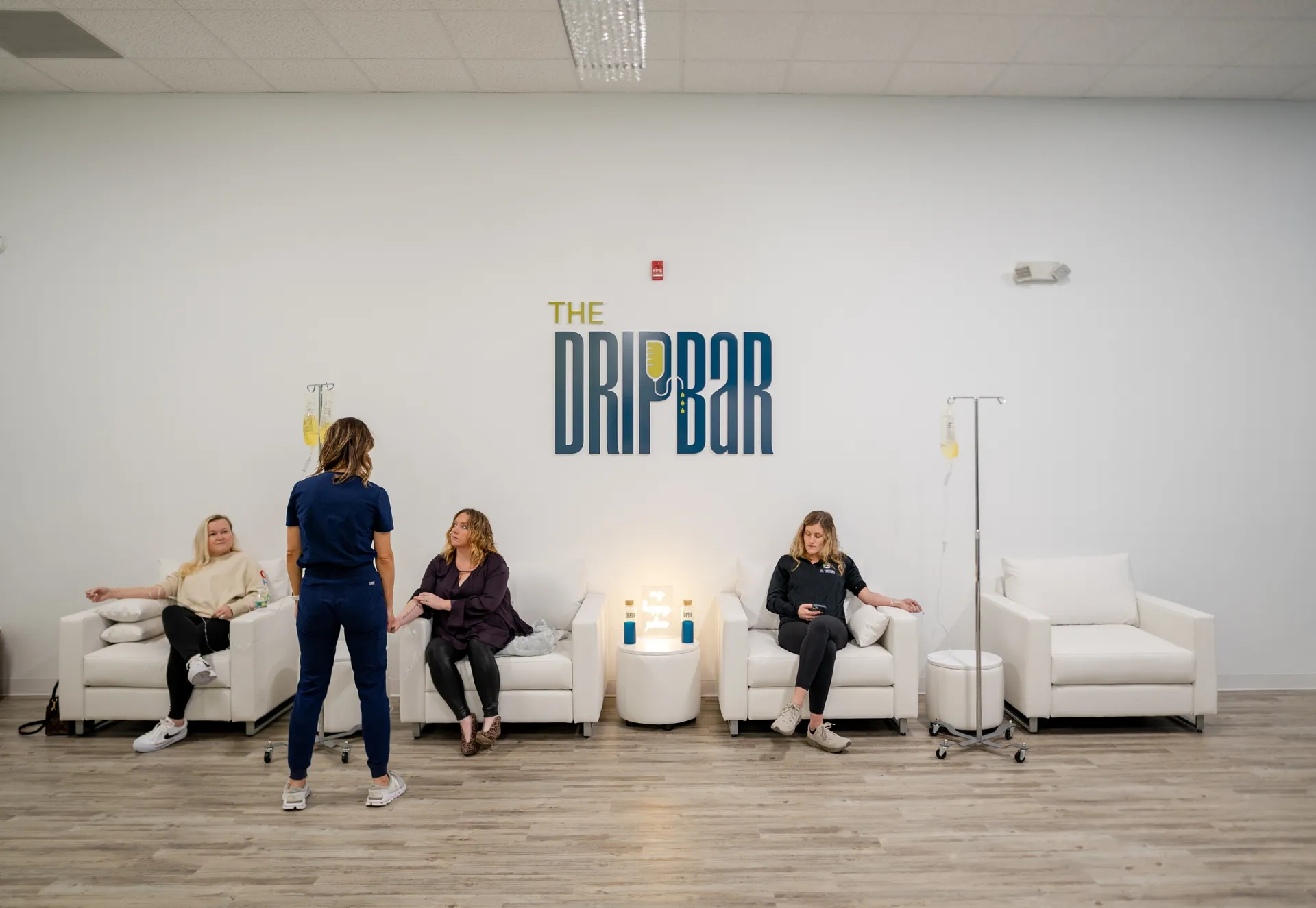 A nurse greeting clients in the lounge